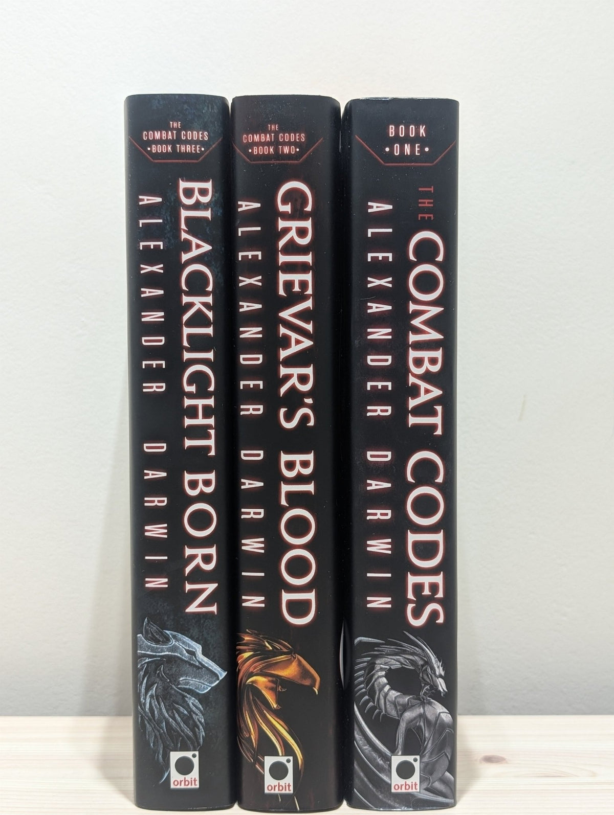The Combat Codes; Grievar's Blood; Blacklight Born by Alexander Darwin (Signed with sprayed edges) - Fialta Books