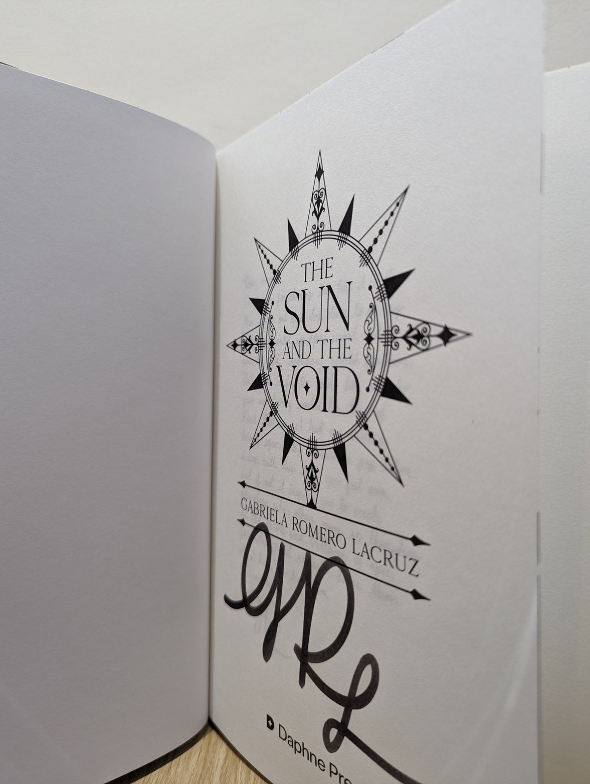 The Sun and The Void by Gabriela Romero Lacruz (Signed First Edition with sprayed edges) - Fialta Books