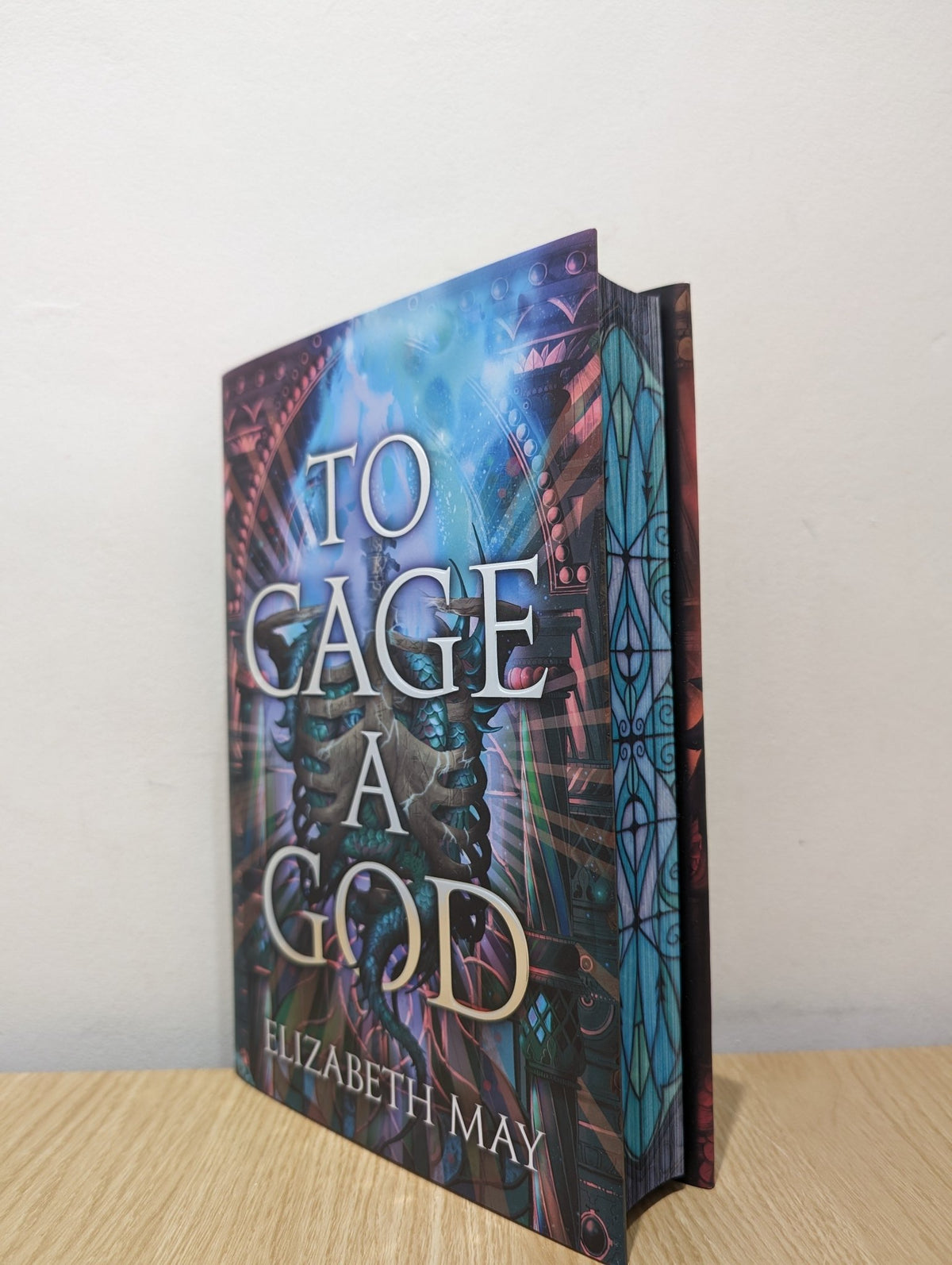 To Cage a God by Elizabeth May (Signed First Edition with sprayed edges) - Fialta Books