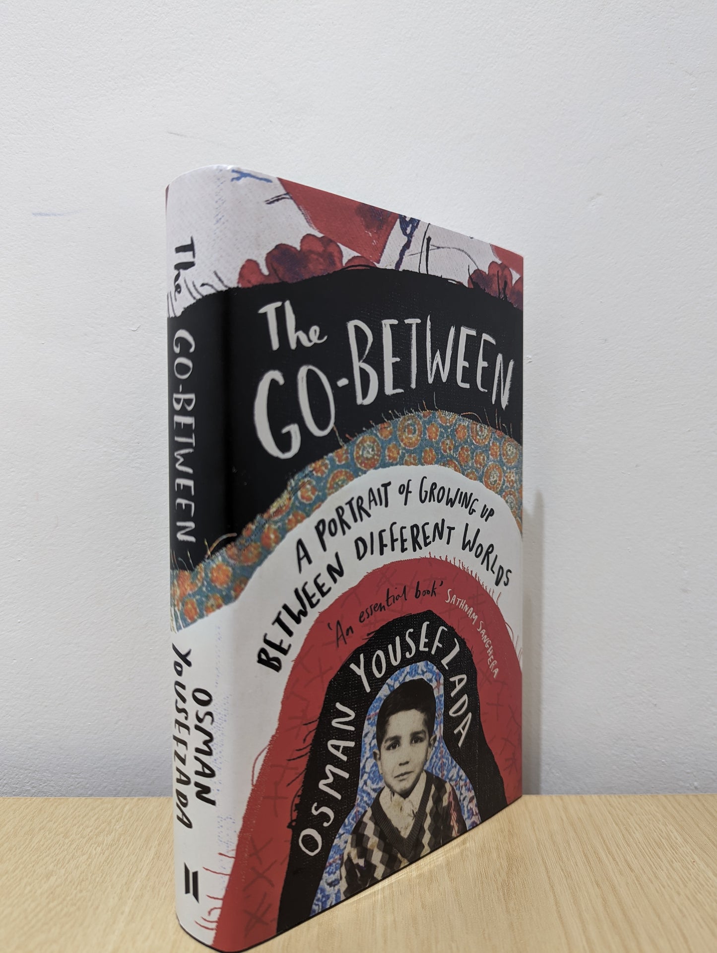 The Go-Between: A Portrait of Growing Up Between Different Worlds (Signed First Edition)