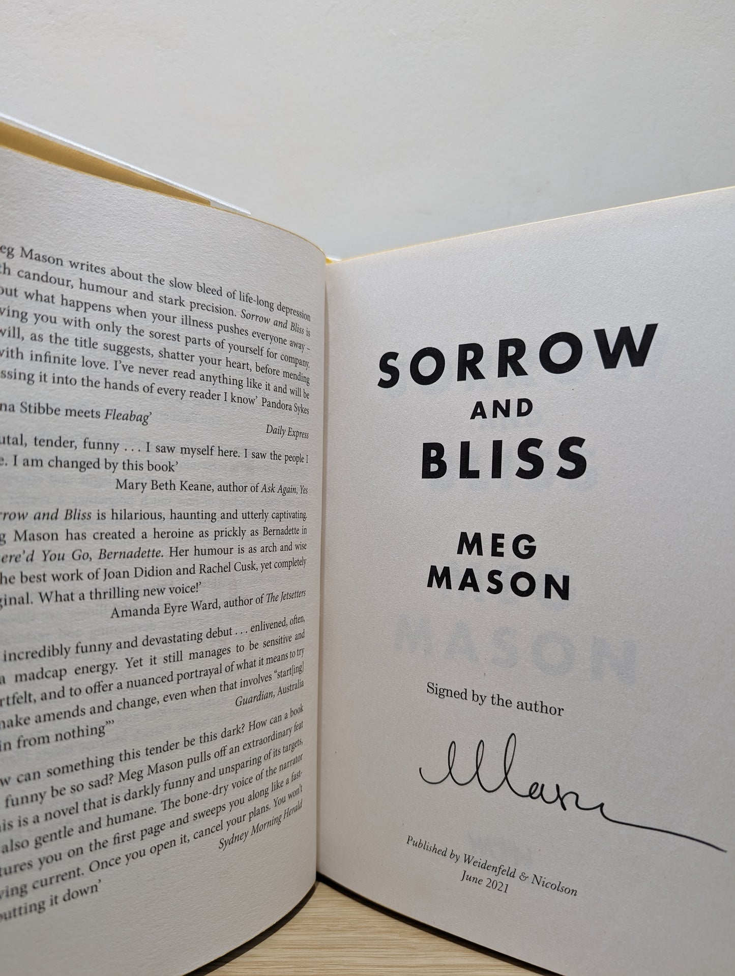 Sorrow and Bliss (Signed First Edition with sprayed edges and extra essay)