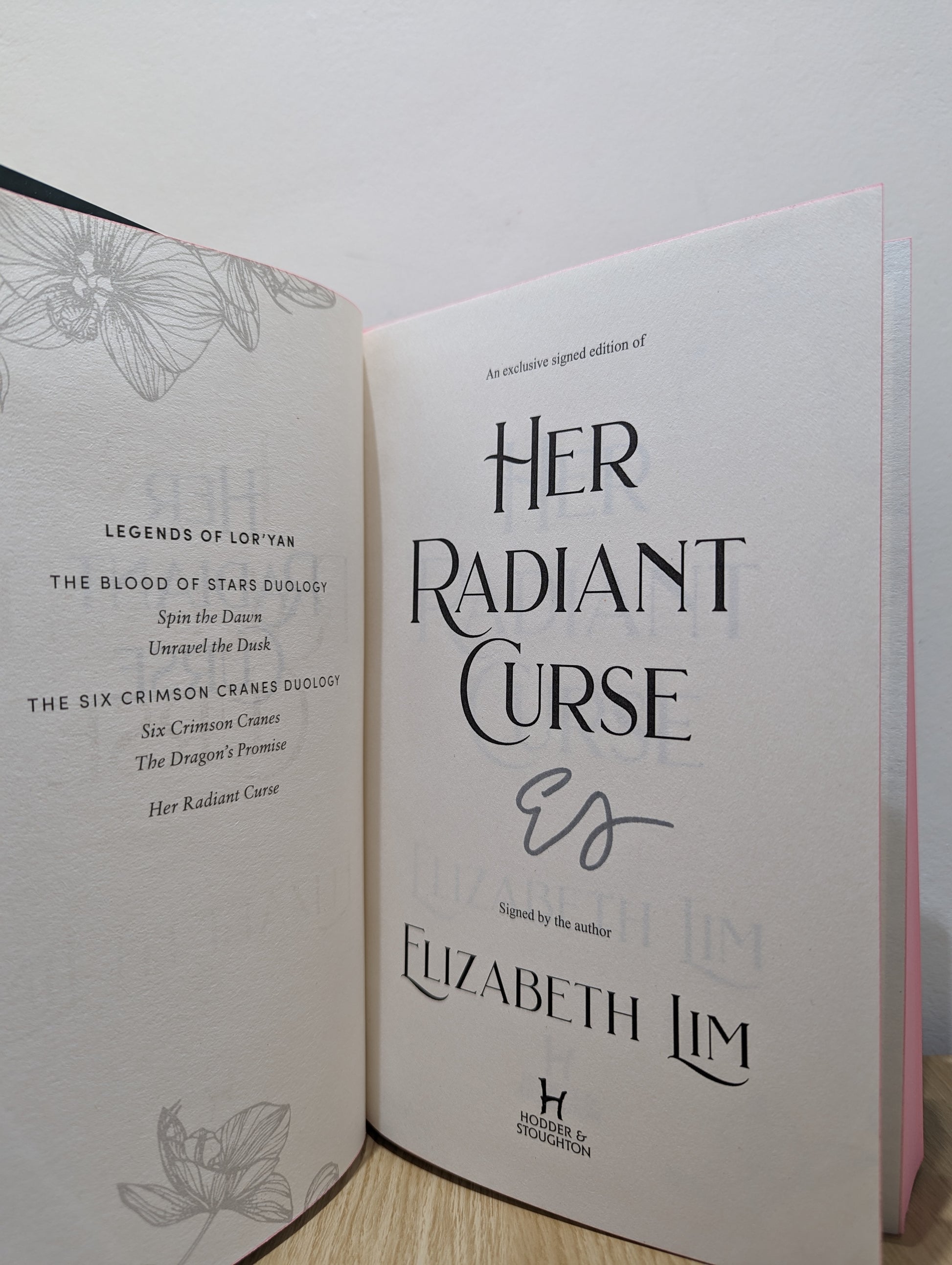 Her Radiant Curse: An enchanting fantasy, set in the same world as New York Times bestselling Six Crimson Cranes (Signed First Edition with sprayed edges)