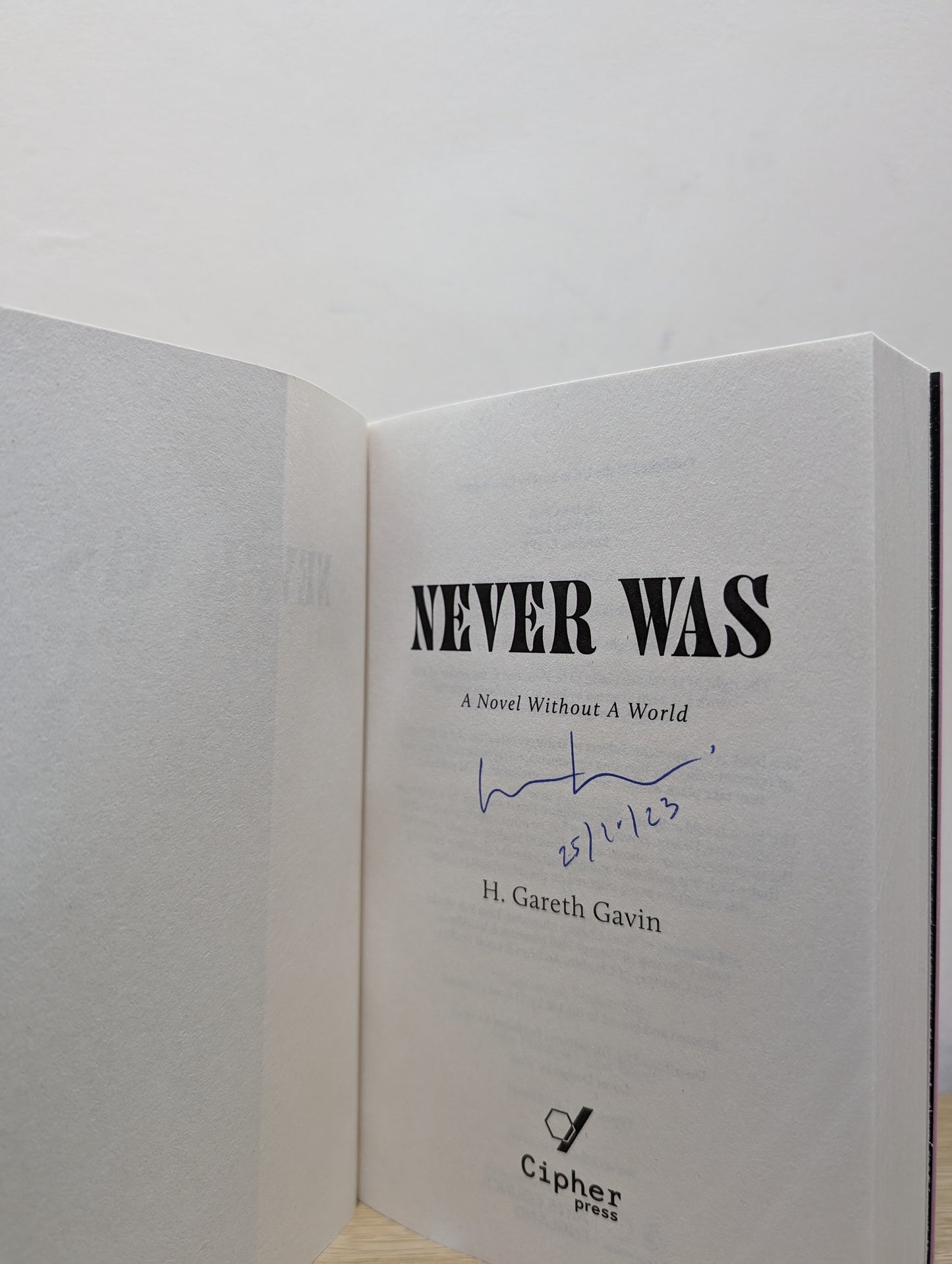 Never Was (Signed Dated First Edition)