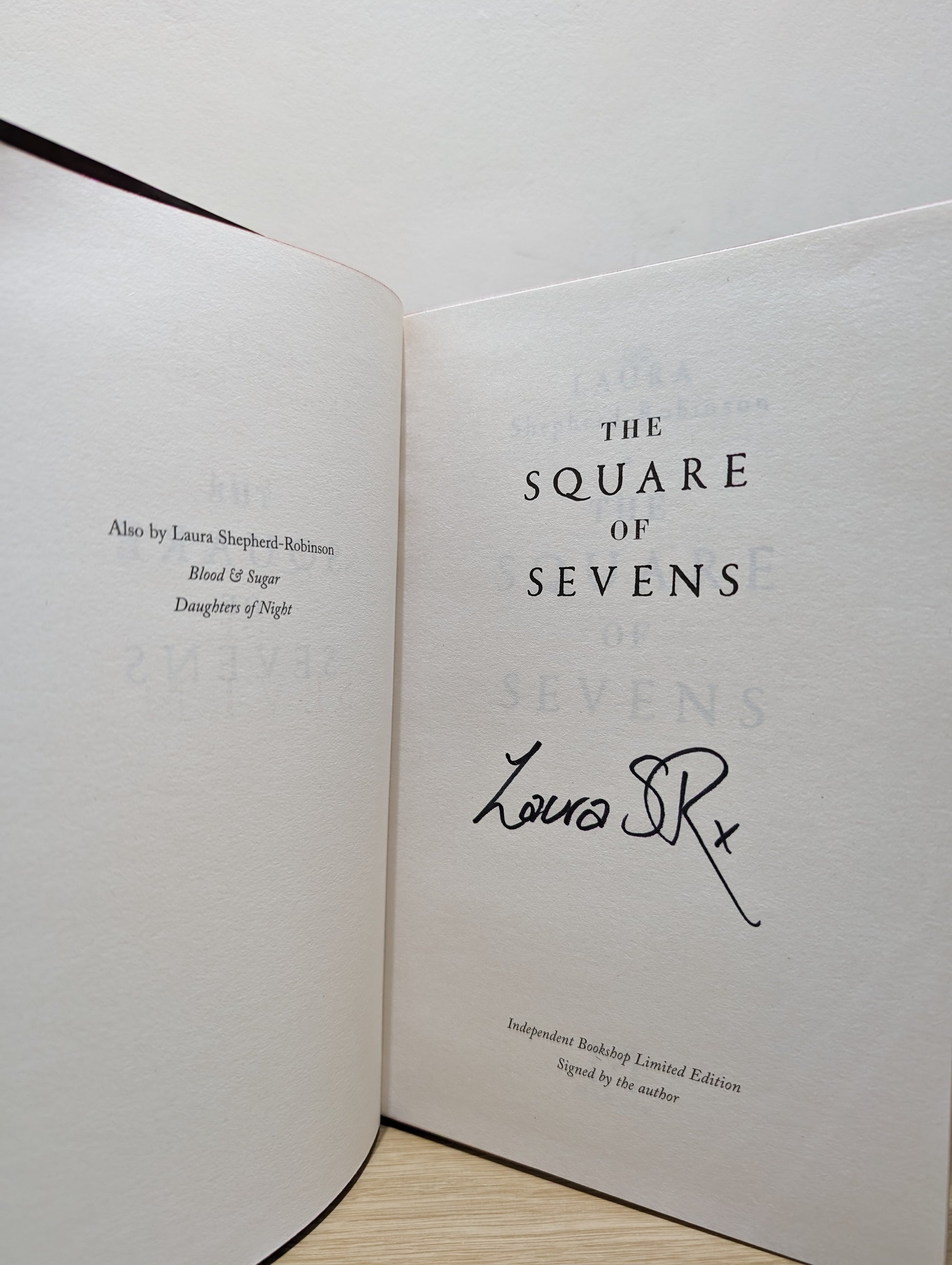 The Square of Sevens (Signed First Edition with sprayed edges)