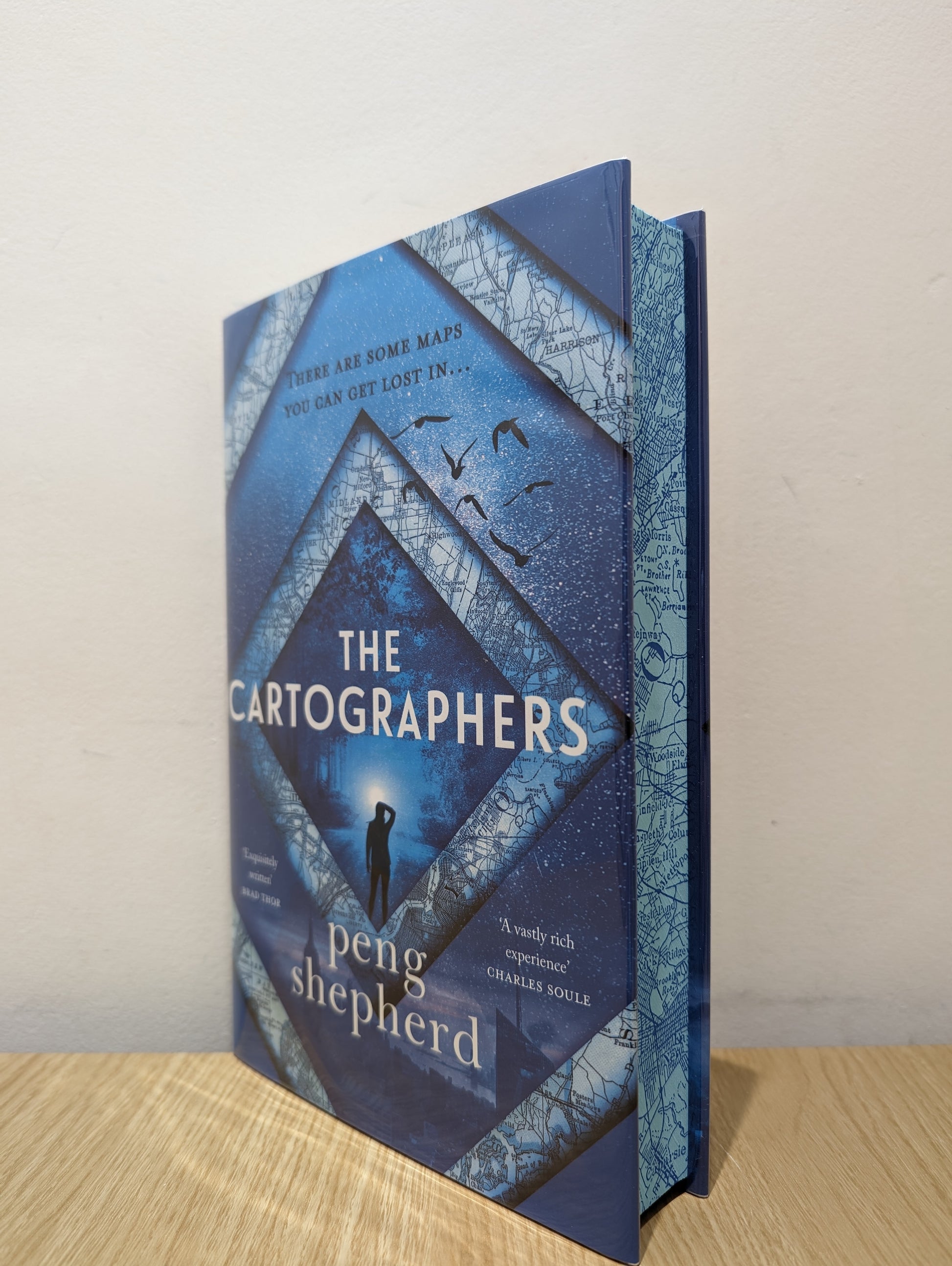 The Cartographers (Signed First Edition with sprayed edges)