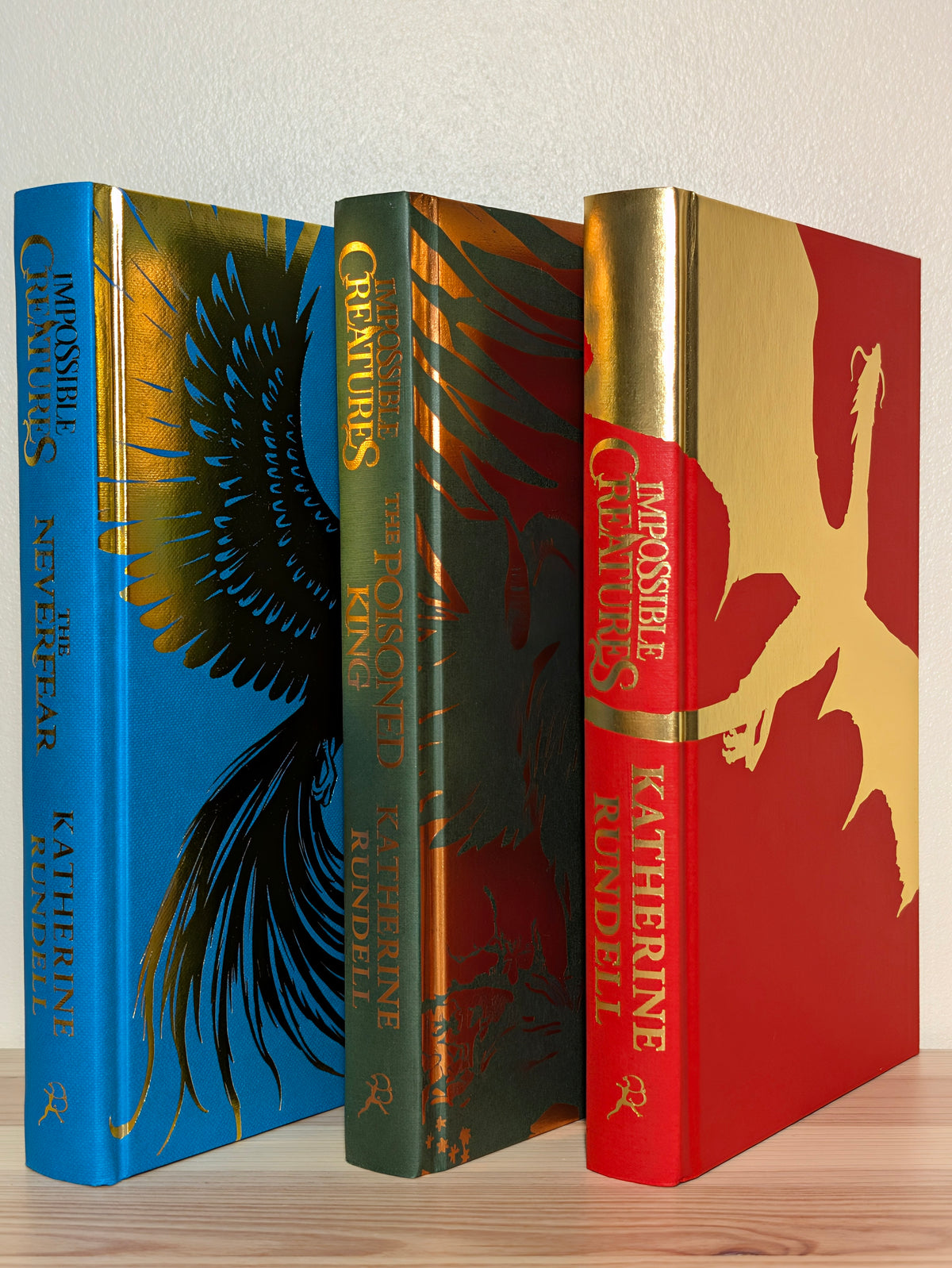Impossible Creatures; Poisoned King; Neverfear by Katherine Rundell (Signed Set with foil on boards)