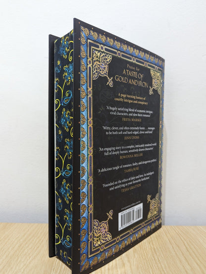 A Taste of Gold and Iron by Alexandra Rowland (Signed First Edition with sprayed edges) - Fialta Books