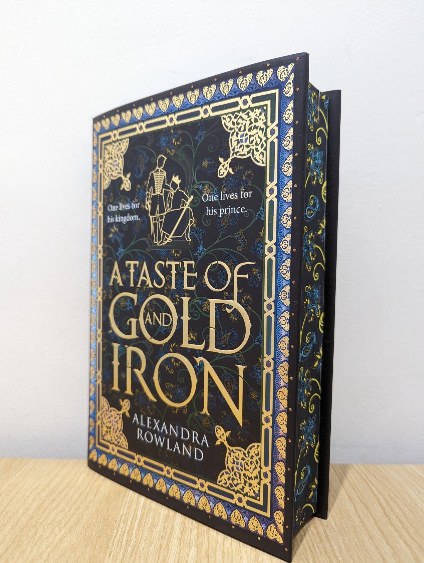 A Taste of Gold and Iron by Alexandra Rowland (Signed First Edition with sprayed edges) - Fialta Books