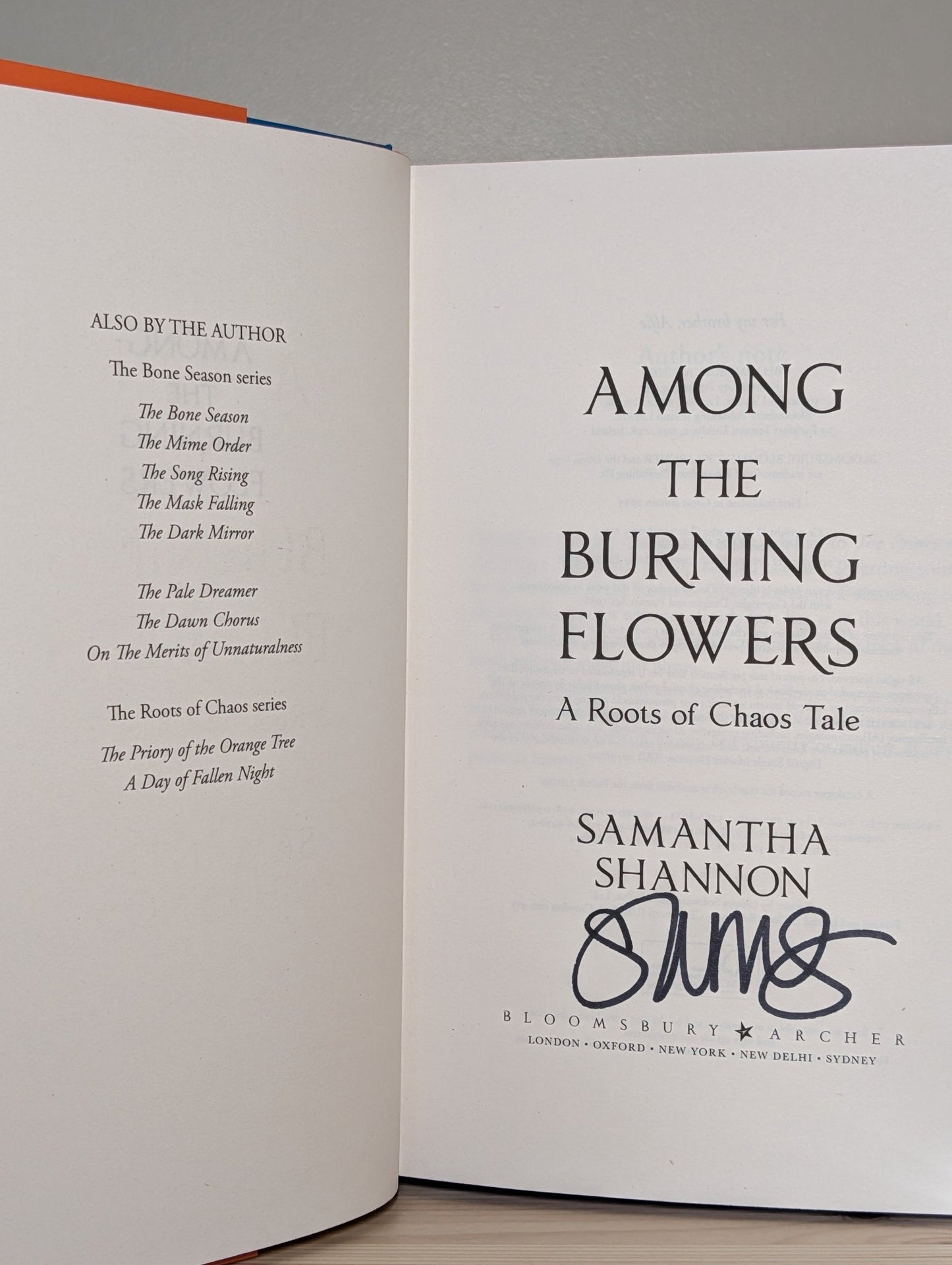 Among the Burning Flowers: Roots of Chaos by Samantha Shannon (Signed First Edition with sprayed edges) - Fialta Books