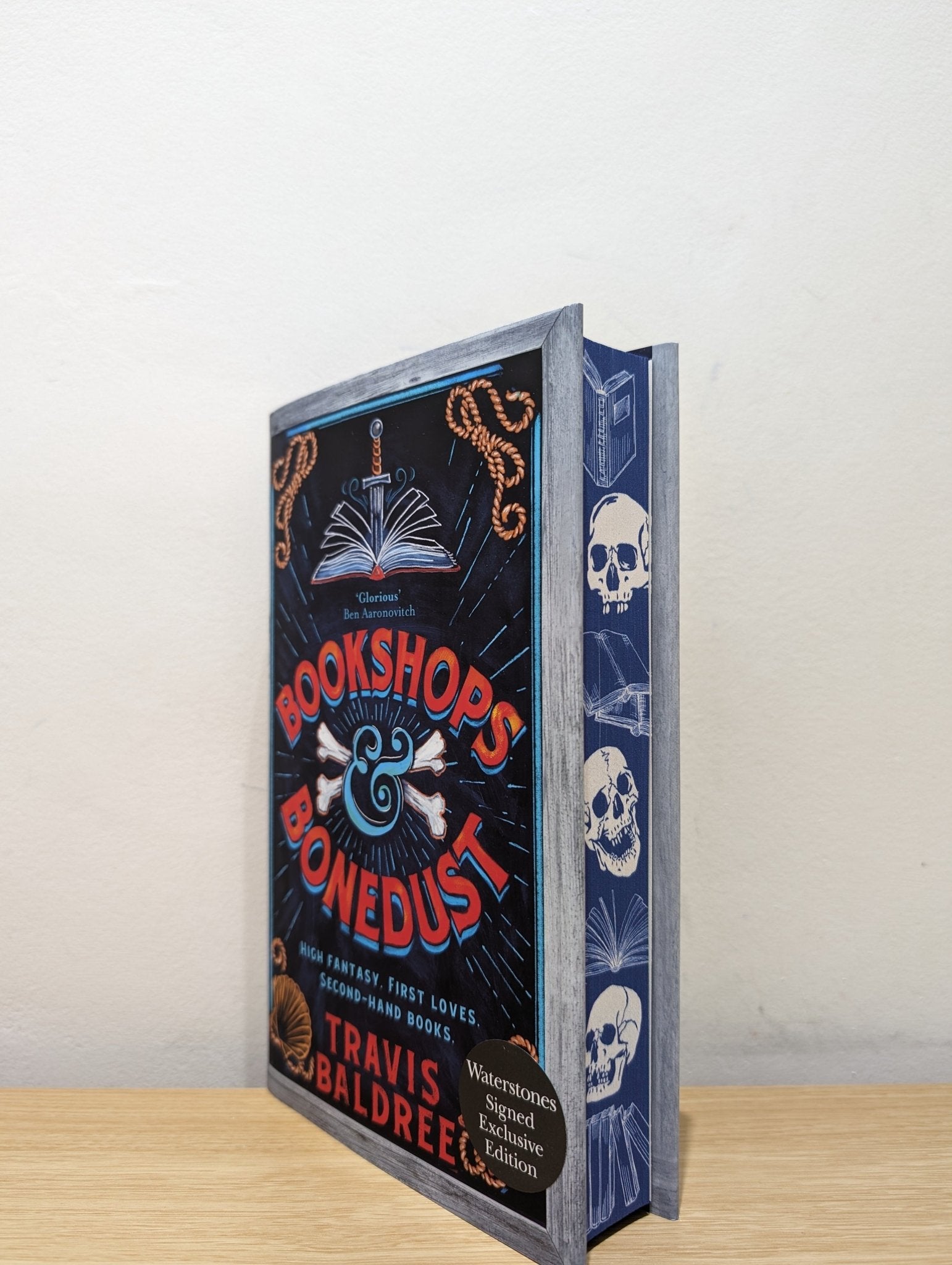 Bookshops & Bonedust by Travis Baldree (Signed First Edition with sprayed skull edges) - Fialta Books