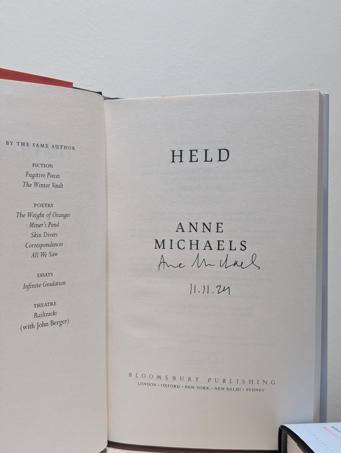 Held by Anne Michaels (Signed Dated First Edition) - Fialta Books