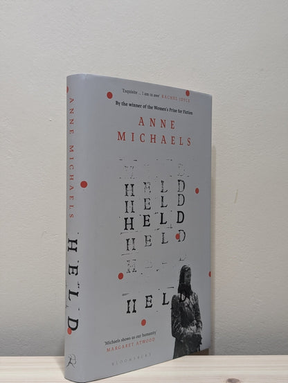 Held by Anne Michaels (Signed Dated First Edition) - Fialta Books