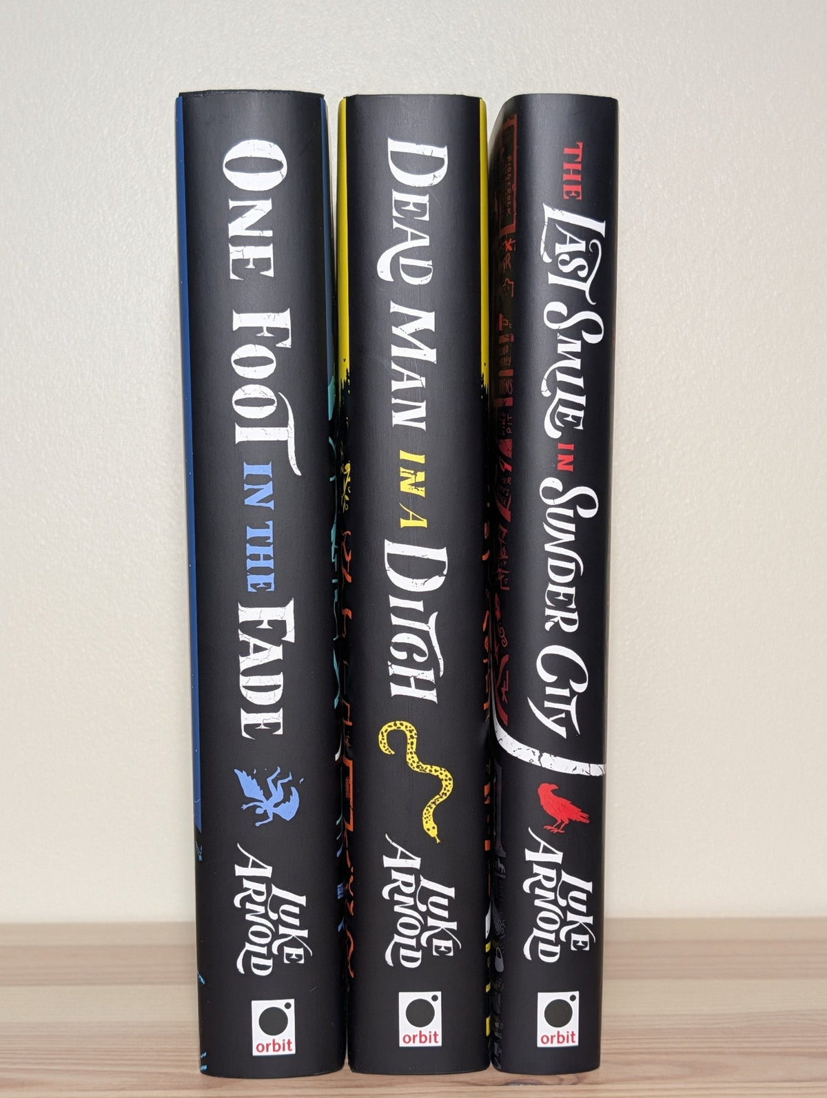 Last Smile in Sunder City; Dead Man in a Ditch by Luke Arnold; One Foot in the Fade (Signed with sprayed edges) - Fialta Books