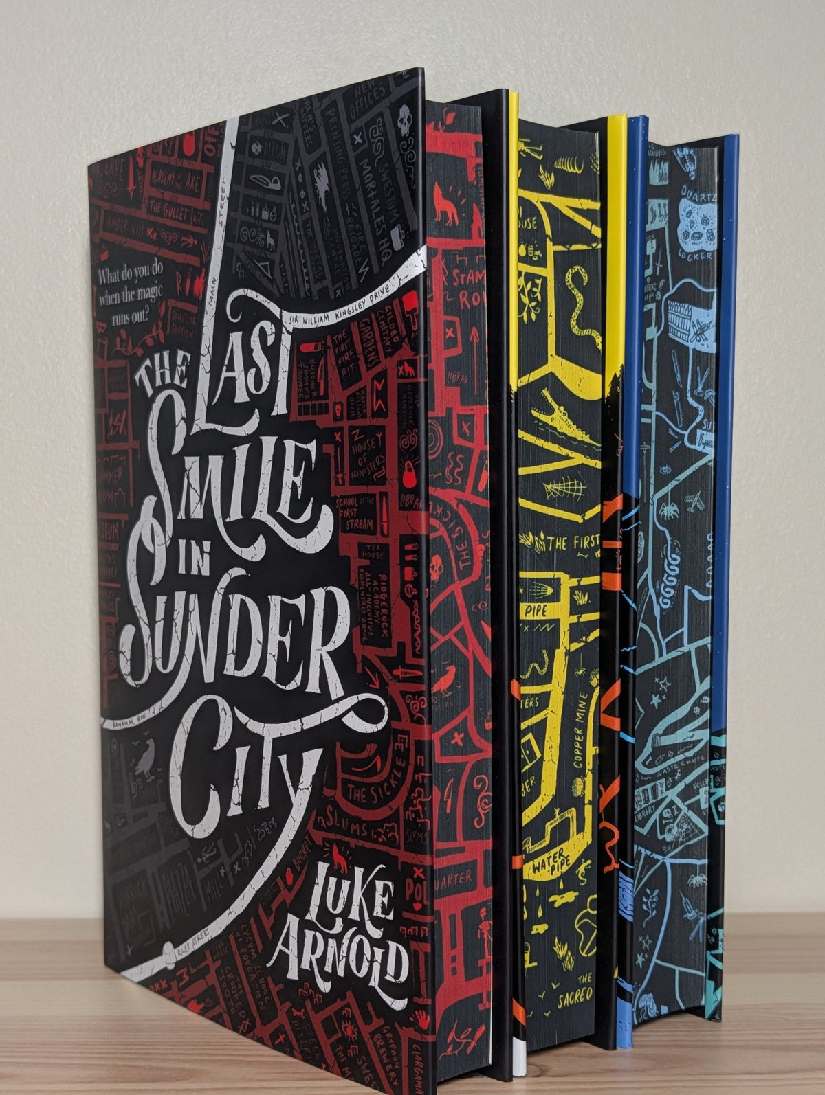 Last Smile in Sunder City; Dead Man in a Ditch by Luke Arnold; One Foot in the Fade (Signed with sprayed edges) - Fialta Books