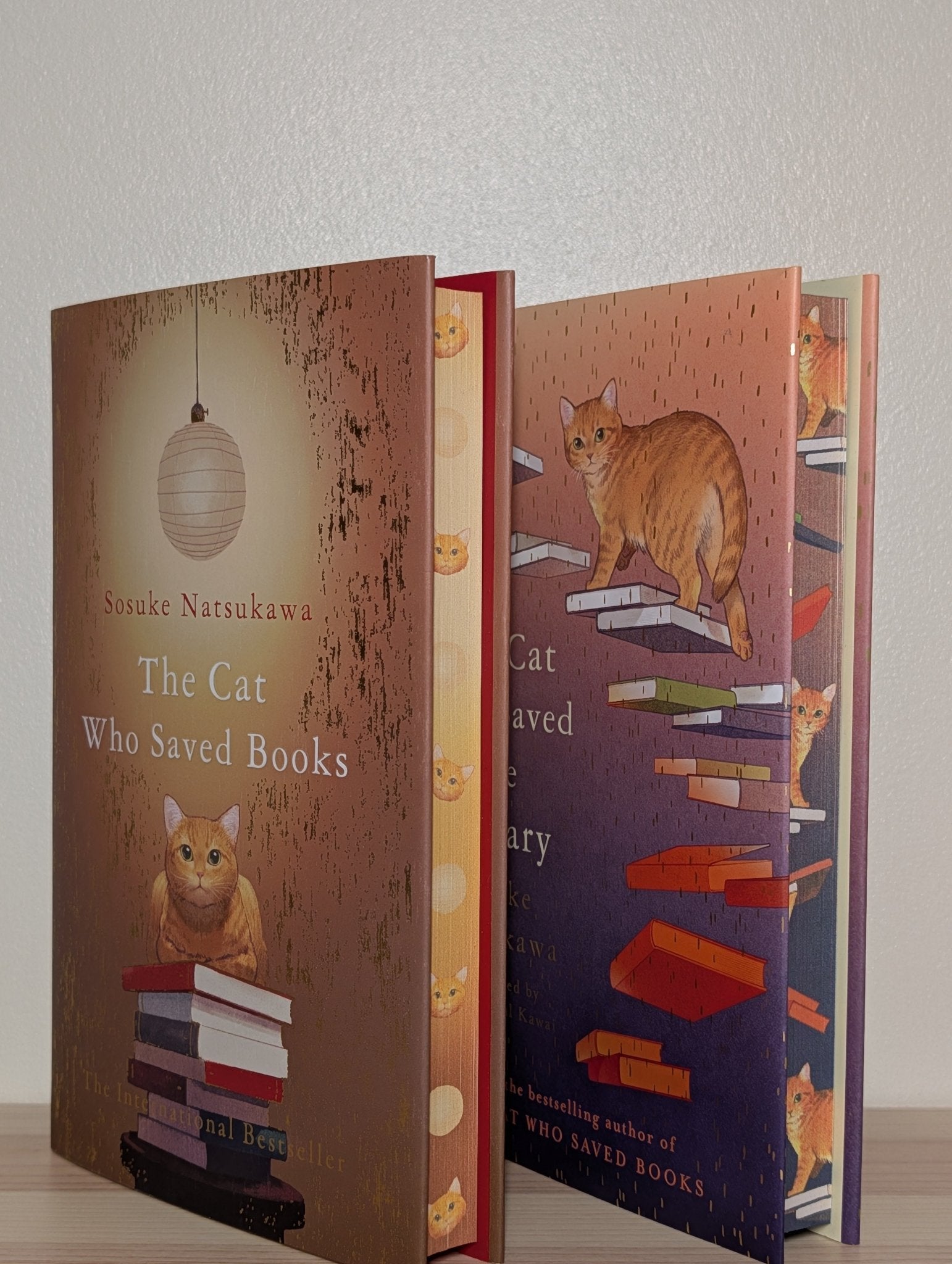 The Cat Who Saved Books; The Cat Who Saved the Library by Sosuke Natsukawa (First Edition Set with sprayed edges) - Fialta Books