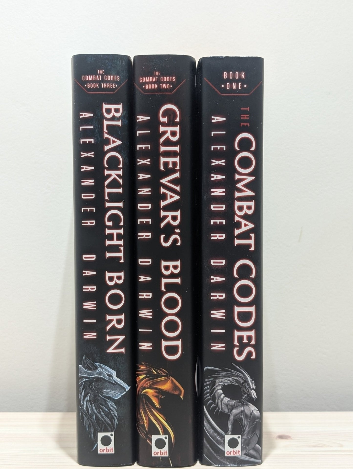 The Combat Codes; Grievar's Blood; Blacklight Born by Alexander Darwin (Signed with sprayed edges) - Fialta Books