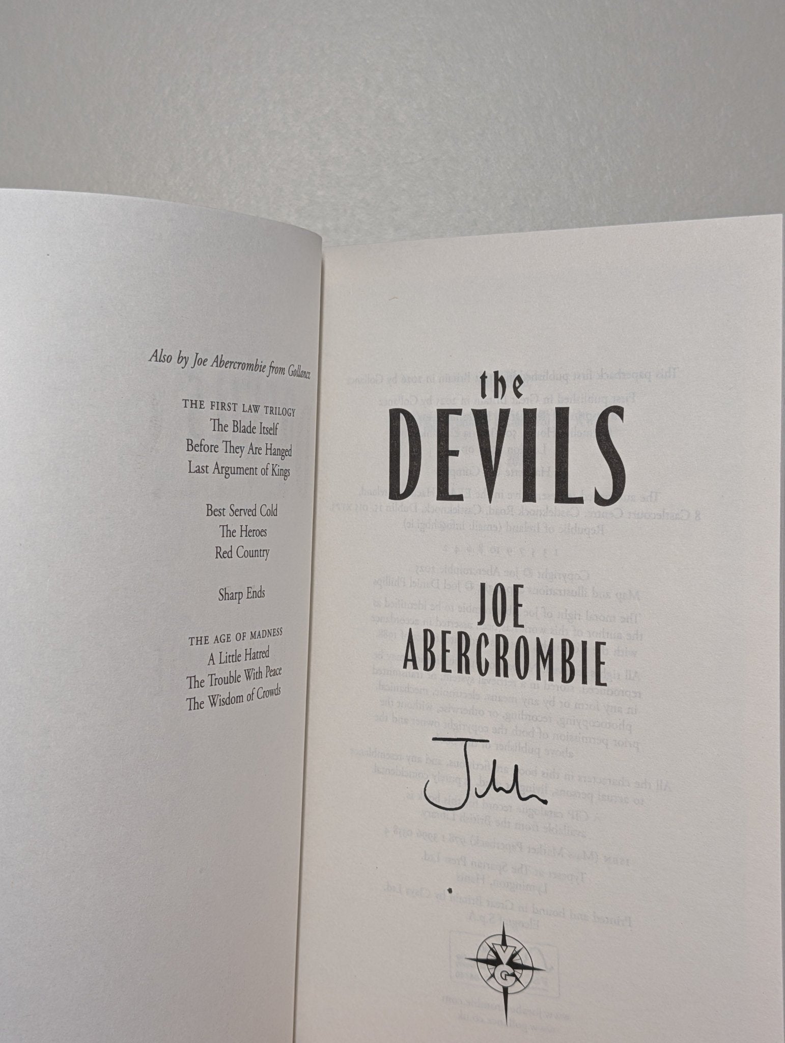 The Devils by Joe Abercrombie (Signed Paperback) - Fialta Books