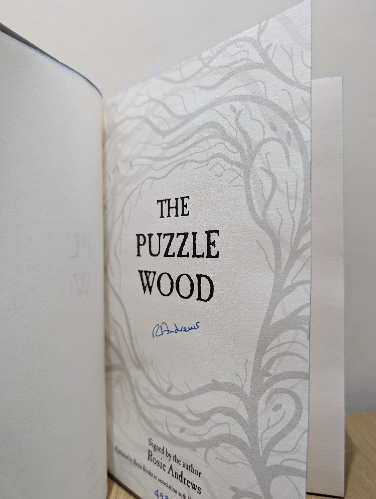 The Puzzle Wood by Rosie Andrews (Signed Numbered First Edition with sprayed edges) - Fialta Books