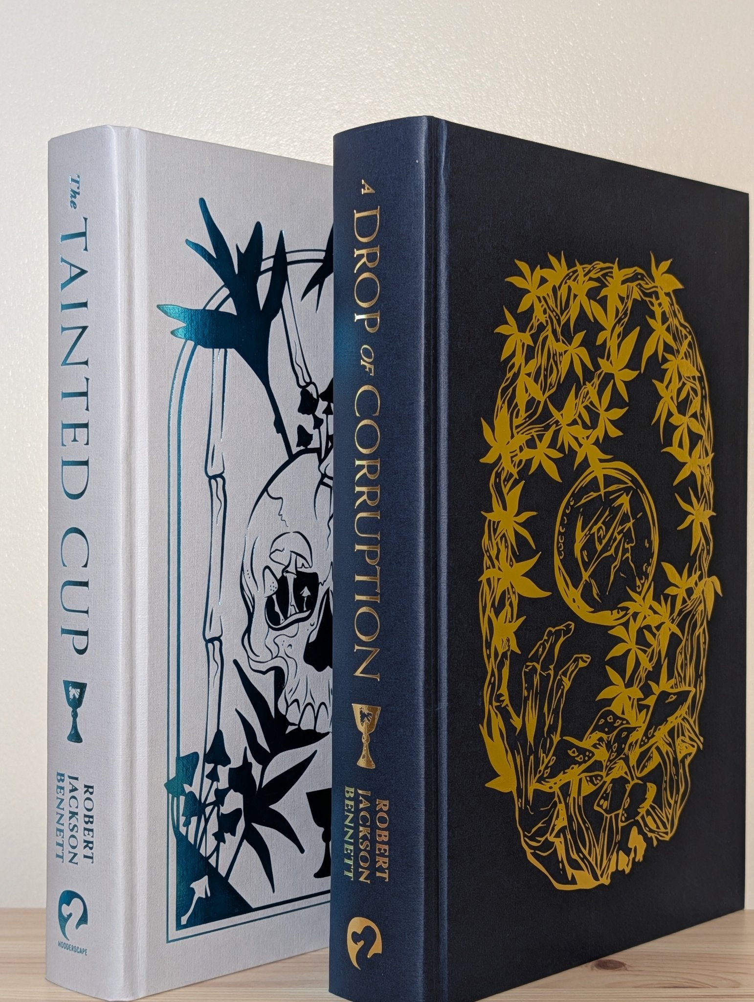 The Tainted Cup; A Drop of Corruption by Robert Jackson Bennett (Signed with Sprayed Edges) - Fialta Books