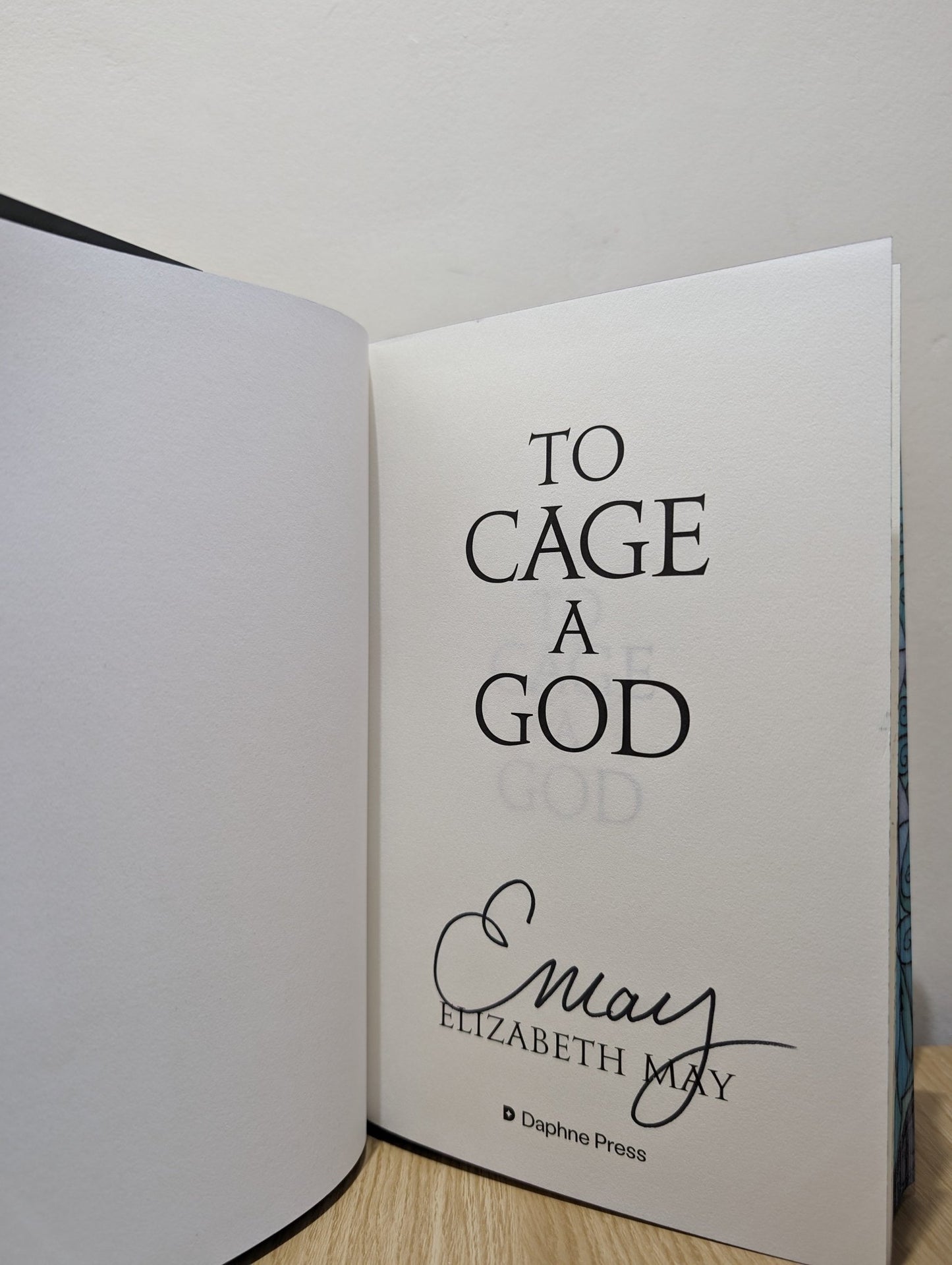 To Cage a God by Elizabeth May (Signed First Edition with sprayed edges) - Fialta Books