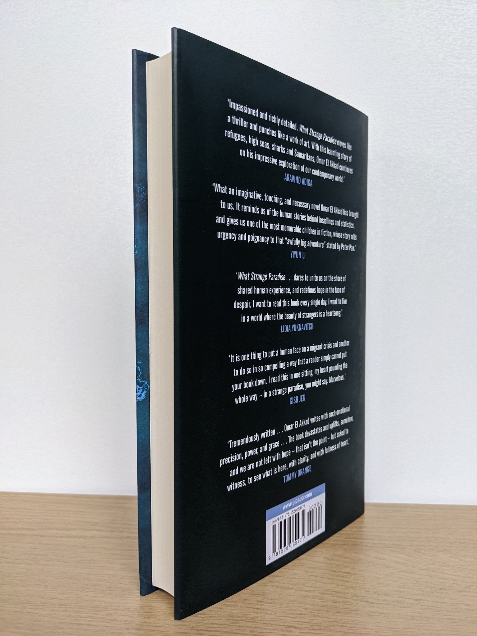 What Strange Paradise by Omar El Akkad (Signed First Edition) - Fialta Books