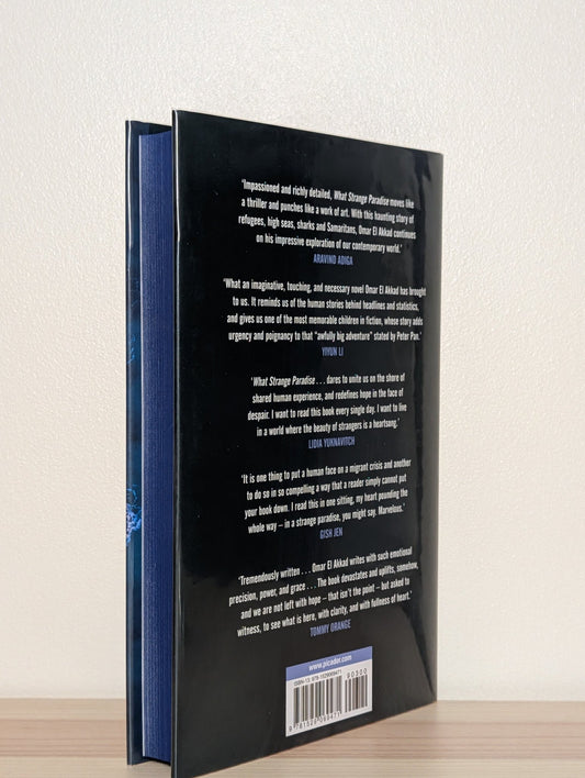 What Strange Paradise by Omar El Akkad (Signed First Edition with sprayed edges) - Fialta Books