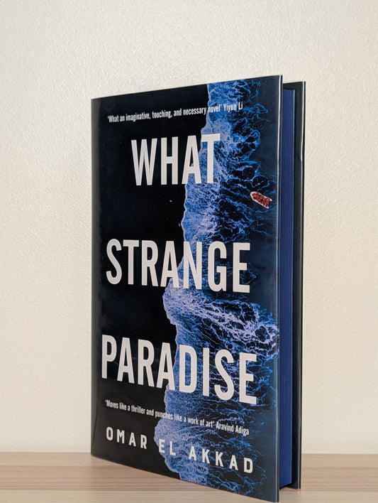 What Strange Paradise by Omar El Akkad (Signed First Edition with sprayed edges) - Fialta Books